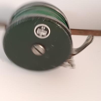 Two fishing reels Shakespeare push button Wondercast No. 1774 and green Fly fishing reel