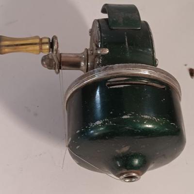 Two fishing reels Shakespeare push button Wondercast No. 1774 and green Fly fishing reel