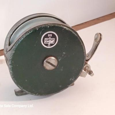 Two fishing reels Shakespeare push button Wondercast No. 1774 and green Fly fishing reel