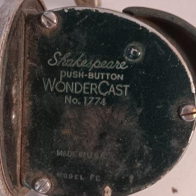 Two fishing reels Shakespeare push button Wondercast No. 1774 and green Fly fishing reel