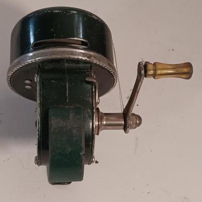 Two fishing reels Shakespeare push button Wondercast No. 1774 and green Fly fishing reel