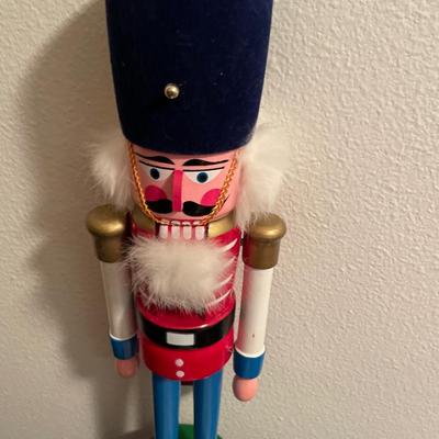 Wooden nutcracker and tote full of ornaments