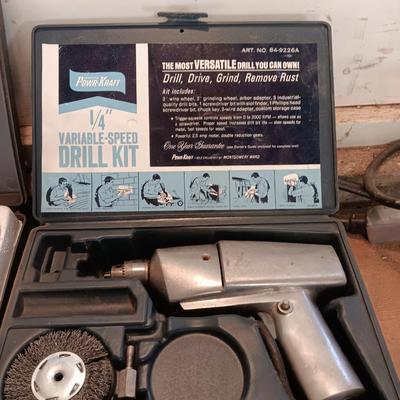 Electric 1/4" Varible-speed drill kit with case and contents