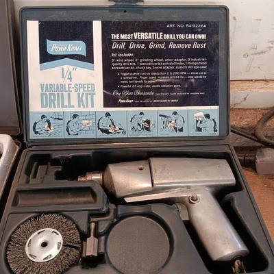 Electric 1/4" Varible-speed drill kit with case and contents