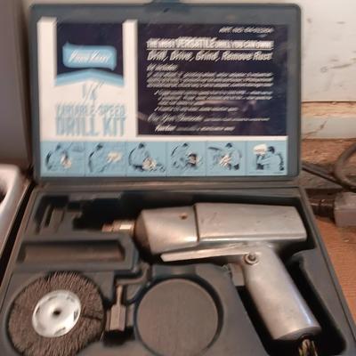 Electric 1/4" Varible-speed drill kit with case and contents
