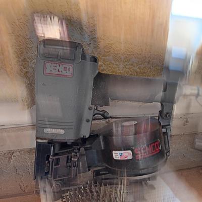Senco Fastening systems SCN40R coil roofing Nailer with partial box of nails