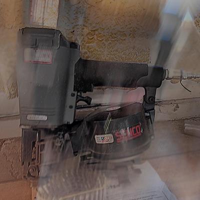 Senco Fastening systems SCN40R coil roofing Nailer with partial box of nails