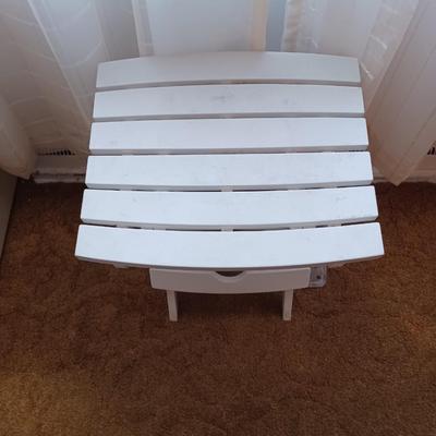 white plastic tv stand