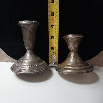 TWO STERLING SILVER (WEIGHTED) CANDLE STICK HOLDERS