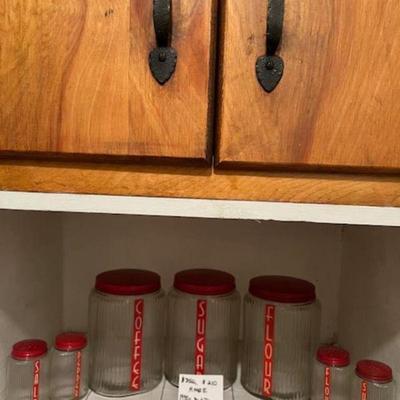 RARE Hoosier 1930s Deco Canister Set Reduced from $250 to $210
Owens Illinois clear ribbed Ovid shaped 7 piece Red top with red and white...