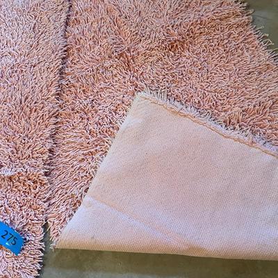 Peach colored shag rugs