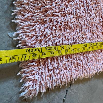 Peach colored shag rugs