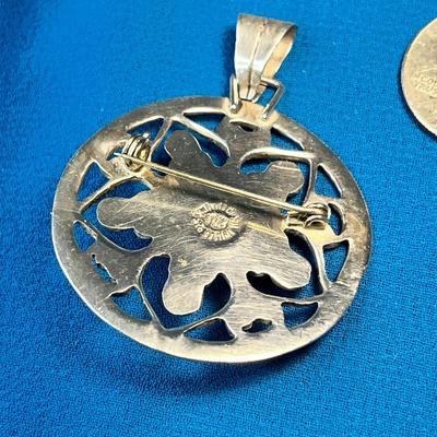 .925 SILVER ROUND PENDANT WITH BLUE CENTER STONE MARKED MEXICO AND ARTIST'S MARK 