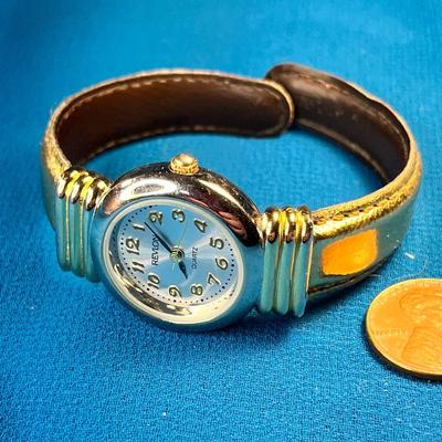 REVLON QUARTZ LADIES WRIST WATCH WITH GOLD FAUX LEATHER CUFF BAND