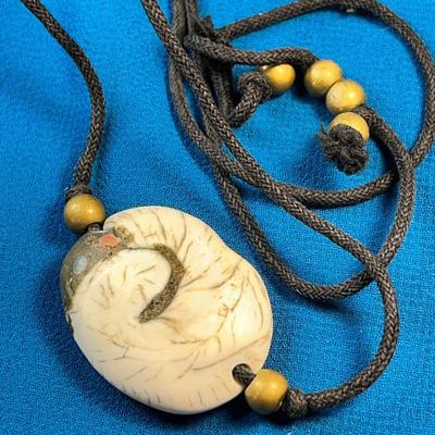 ANCIENT SEA SHELL FOSSIL NECKLACE WITH EMBEDDED COLORFUL STONES