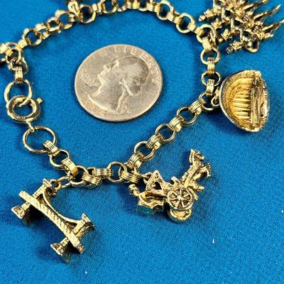 GOLDTONE NEW YORK CITY CHARM BRACELET: TIMES SQUARE, ROCKETTES, BROOKLYN BRIDGE, ETC.