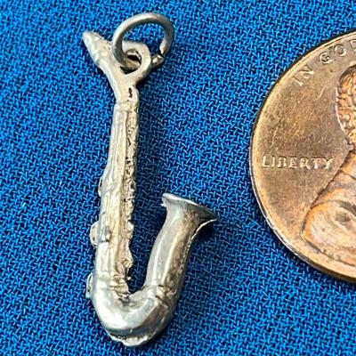 SAXOPHONE CHARM UNMARKED BUT PROBABLY SILVER 