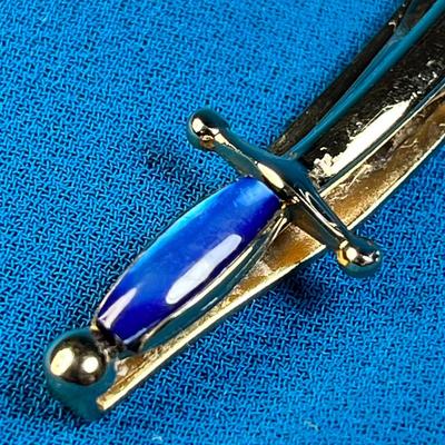 GOLDTONE SCIMITAR WITH BLUE STONE TIE BAR by SWANK