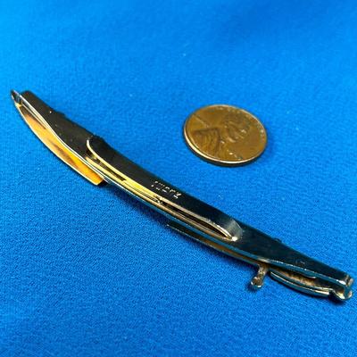 GOLDTONE SCIMITAR WITH BLUE STONE TIE BAR by SWANK