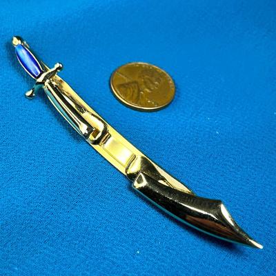 GOLDTONE SCIMITAR WITH BLUE STONE TIE BAR by SWANK
