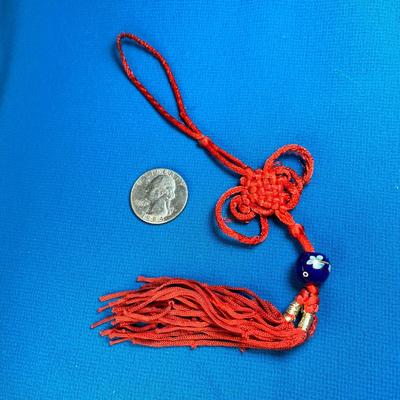 CHINESE RED TASSLE WITH FANCY KNOT AND PAINTED CERAMIC BEAD