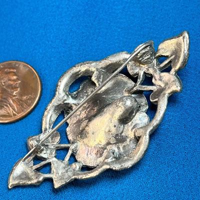 FANCY 3-D FLOWER PIN WITH RED RHINESTONE CENTER AND INTRICATE LEAVES