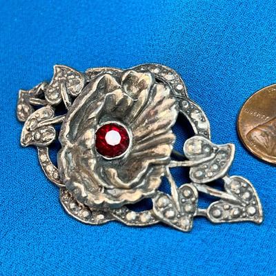 FANCY 3-D FLOWER PIN WITH RED RHINESTONE CENTER AND INTRICATE LEAVES