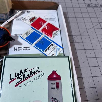 Crafting items: Stamp pad, Glue Gun and Paint Brushes. 