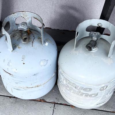 2 Partial 5 gallon propane tanks