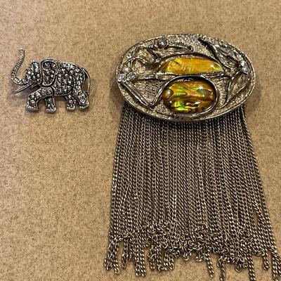 Small elephant and fringe brooches