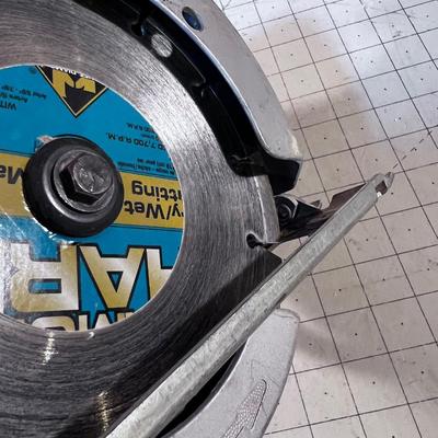 7-1/4" Skill Saw with a masonry Blade.