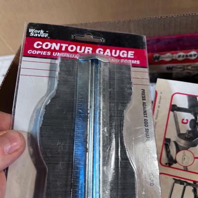 Box of Misc. Tools: Chain Saw Sharpener, Tape Measures, etc. 