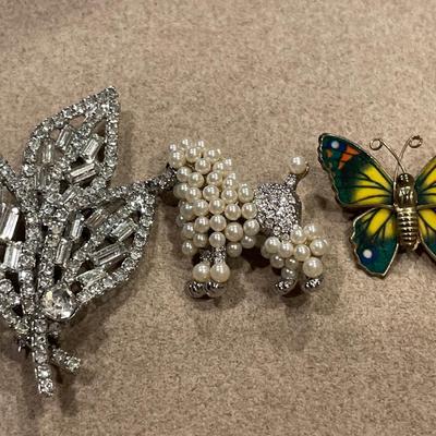 Leaf, poodle and butterfly brooches