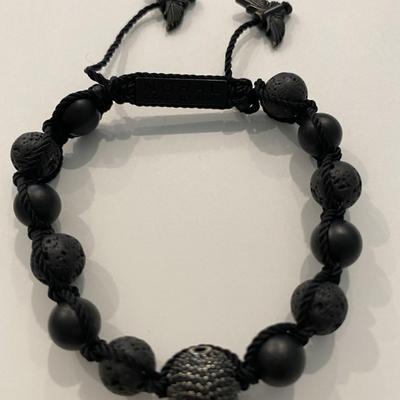 Noral Collection black onyx bracelet with black metal skull bead and adjustable strap