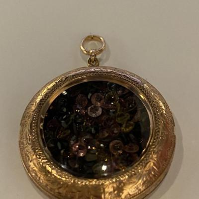 Vintage 14k pendant filled with Topaz stones