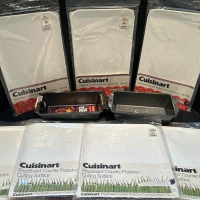 Lot 35 cutting boards & loaf pans