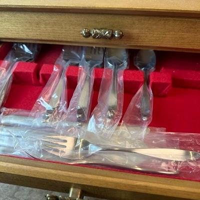 Lot 169 Lauffer Stainless Steel Flatware in wood chest