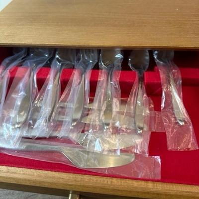 Lot 169 Lauffer Stainless Steel Flatware in wood chest