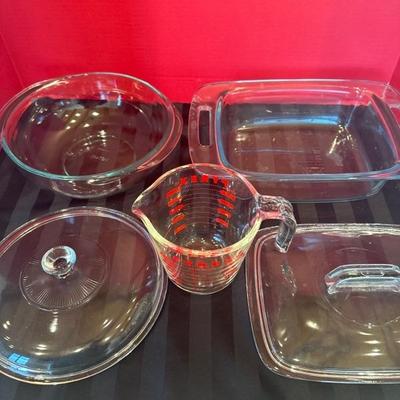 Lot 184 Pyrex Casseroles with lids 1 measuring glass cup