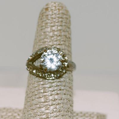 3 Prong Clear Faceted Stone with 14 Stones in a Neck-Wrap Style Surround Size 7 1/4