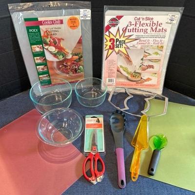 Lot 243 Pyrex glass mixing bowls, flexible cutting boards, kitchen utensils
