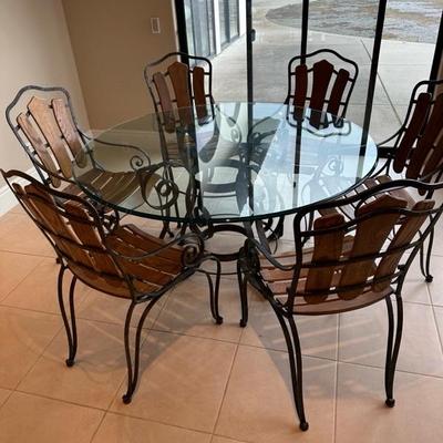 Lot 250 round glass and metal dining set with six chairs