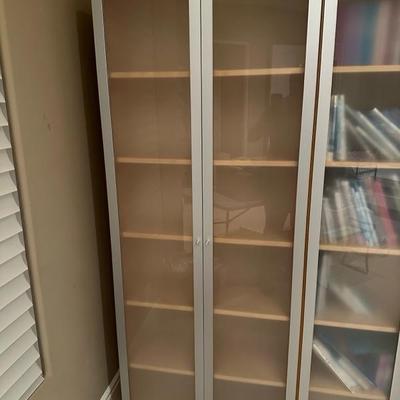 Lot 238 Six shelf frosted glass doors cabinet