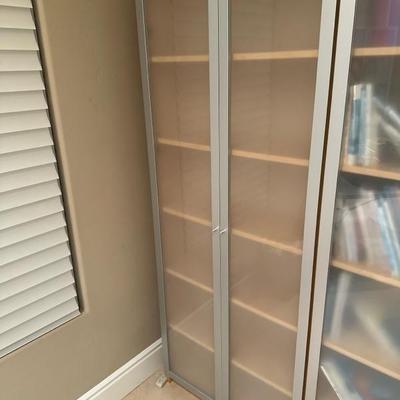 Lot 239 Six shelf frosted glass doors cabinet