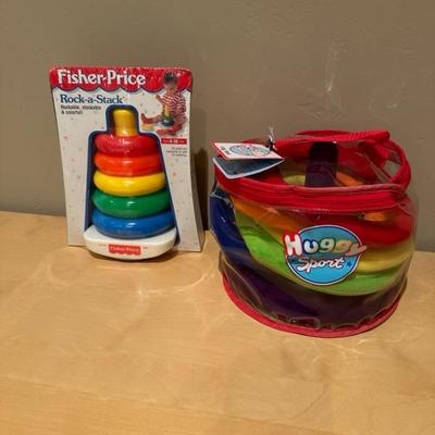 Lot 272 huggy sport ring, toss game and Fisher-Price rock a stack toy