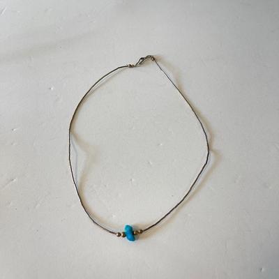 Thin silver necklace with small turquoise nugget