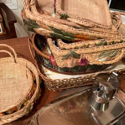 Wood salad bowls and wicker casserole carriers with platters
