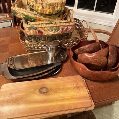 Wood salad bowls and wicker casserole carriers with platters