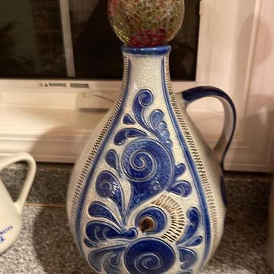 Centennial pottery and large blue pitcher with glass ball on top