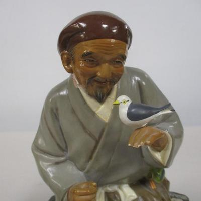 Japanese Vintage Hakata Urasaki Doll Clay Figurine Sitting Man with Bird in Hand